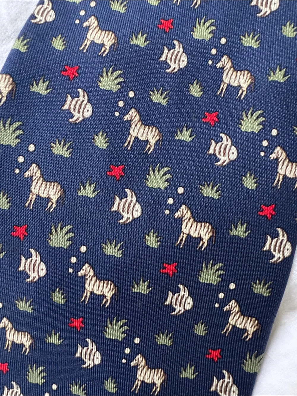 Hermès, navy silk necktie with fish and zebras and starfish MINT